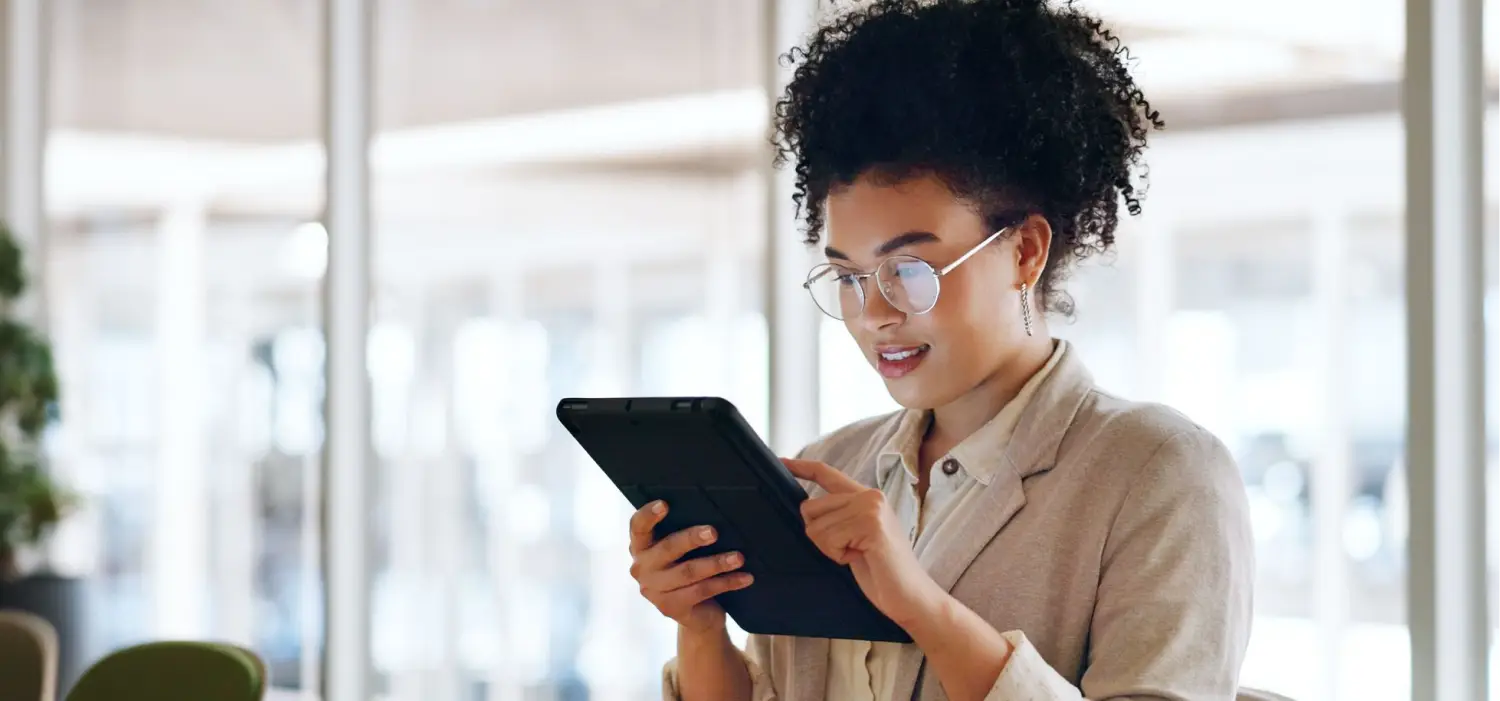 tablet black woman business marketing social media update networking with smile website company blog online communication office worker with glasses smile digital strategy success 1k